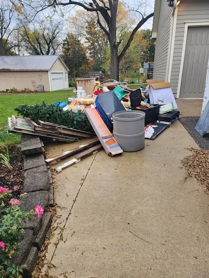 Dumpster being loaded with debris for Residential Dumpster Rental in South Euclid